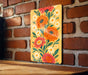 a painting on a brick wall with flowers painted on it