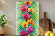 a painting of flowers on a shelf next to a potted plant