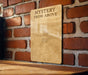 a sign on a brick wall that says mystery from above