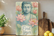 a buddha statue sitting on top of a wooden shelf