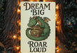 a sign that says dream big roar loud