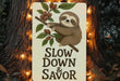 a sign that says slow down and savor on a tree