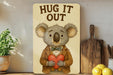 a picture of a koala holding a heart