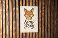 a sign that says stay foxy on a wooden wall