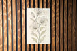 a drawing of a flower on a wooden wall