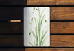 a picture of some flowers on a wooden surface