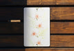 a picture of flowers on a wooden surface