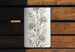 a picture of some flowers on a wooden bench