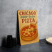 a chicago deep dish pizza sign on a table