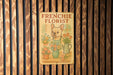 a frenchie florist sign on a wooden wall
