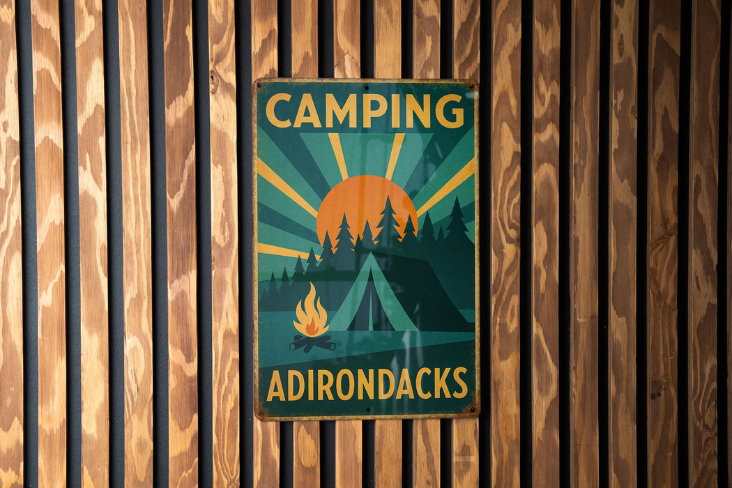 a sign on a wooden wall that says camping adirondacks