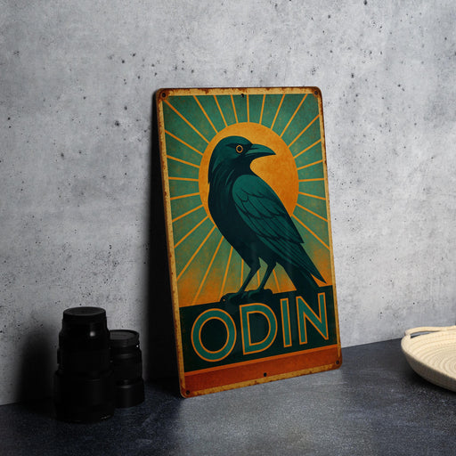 a black bird sitting on top of a wooden sign