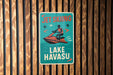 a sign on the side of a building that says get skiing lake hawasu