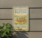 a sign on the side of a building that says whitewater rafting