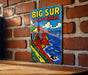 a picture of a big sur california on a brick wall
