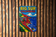 a wooden wall with a sign that says big sur california on it