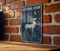 a picture of a deer on a brick wall