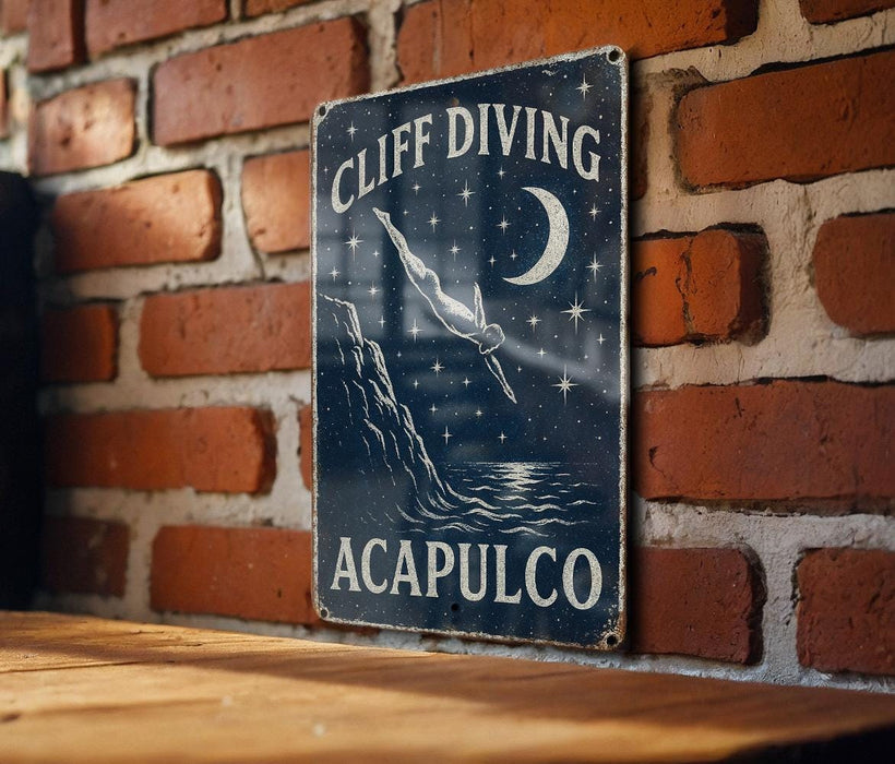 a sign on a brick wall that says cliff diving acapuloco