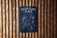 a sign on a wooden wall that says solar flare cat
