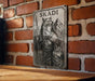 a picture of a woman with a wolf on a brick wall