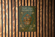 a picture of a fairy ring mushrooms sign on a wooden wall