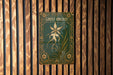 a close up of a sign on a wooden wall