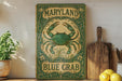 a blue crab sign sitting on top of a wooden shelf