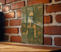 a picture of a nut sign on a brick wall