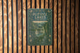 a book is hanging on a wooden wall