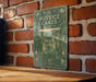 a picture of a book on a brick wall