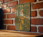 a picture of a woman on a plaque on a brick wall