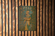 a wooden wall with a painting on it