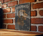 a picture of a dog on a sign on a brick wall