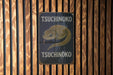 a sign on the side of a wooden building