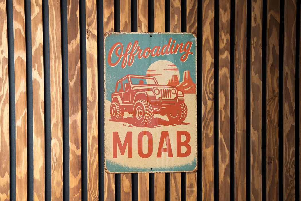 a sign on a wooden wall that says offroading moab