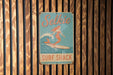 a wooden wall with a sign on it