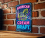a neon sign that reads american cream draft