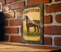 a picture of a horse on a brick wall