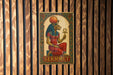 a wooden wall with a painting of an egyptian god