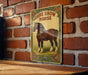 a picture of a horse on a brick wall