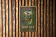 a painting of a man hanging on the side of a wooden wall