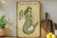 a vintage poster of a mermaid holding a paddle