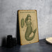 a drawing of a mermaid on a table