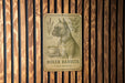 a sign on a wooden wall that says boxer barista