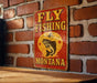 a sign on a brick wall that says fly fishing montana