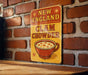 a close up of a sign on a brick wall