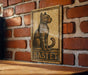 a picture of a cat on a brick wall