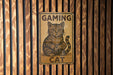 a wooden sign with a cat sitting on top of it