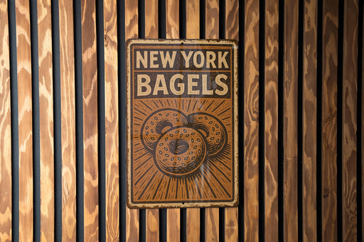 a new york bagels sign on a wooden wall