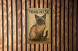 a picture of a cat on a wooden wall